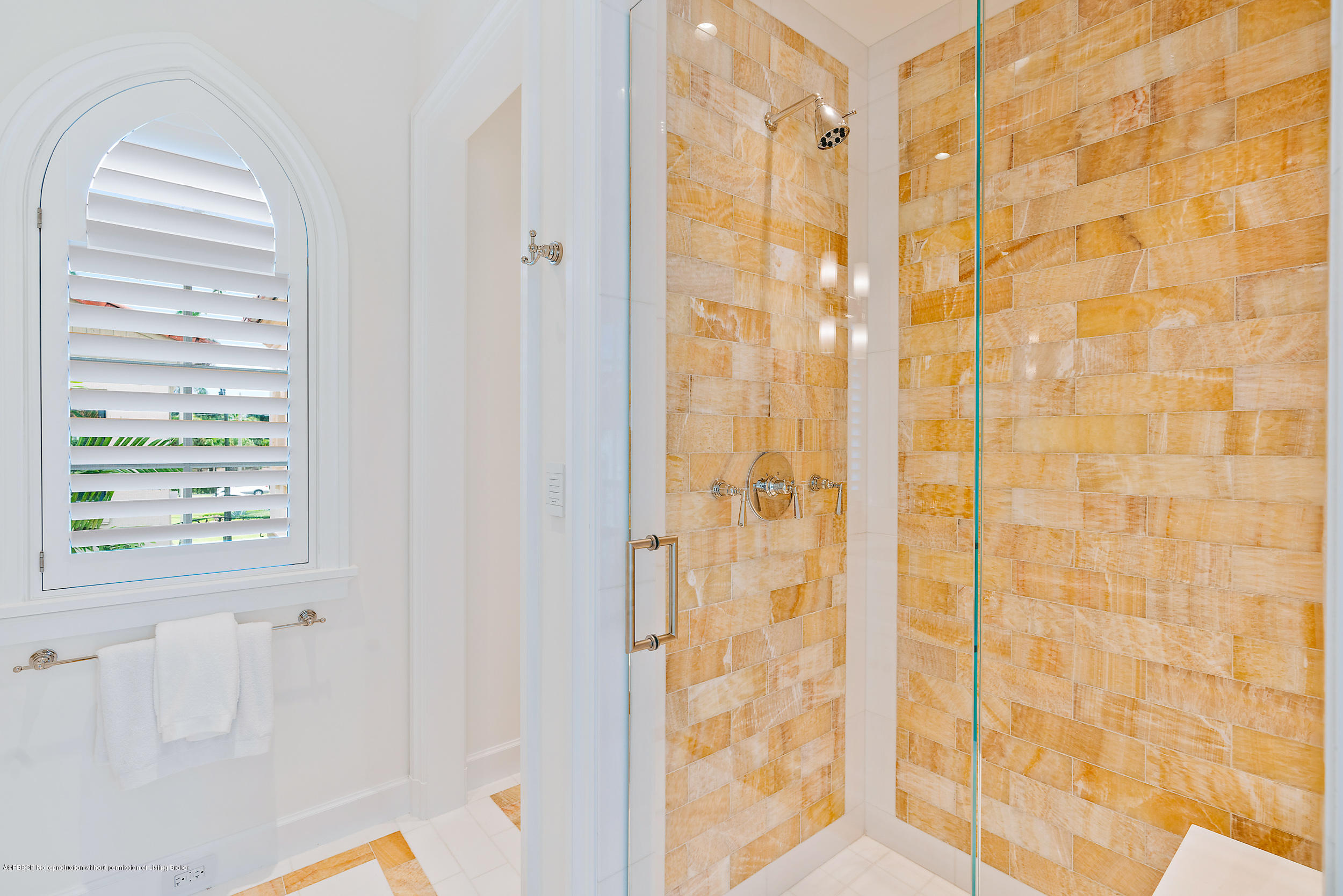 3 Via Flagler Palm Beach, FL 33480 - Photo 24 of 42 a bathroom with a shower curtain and a window