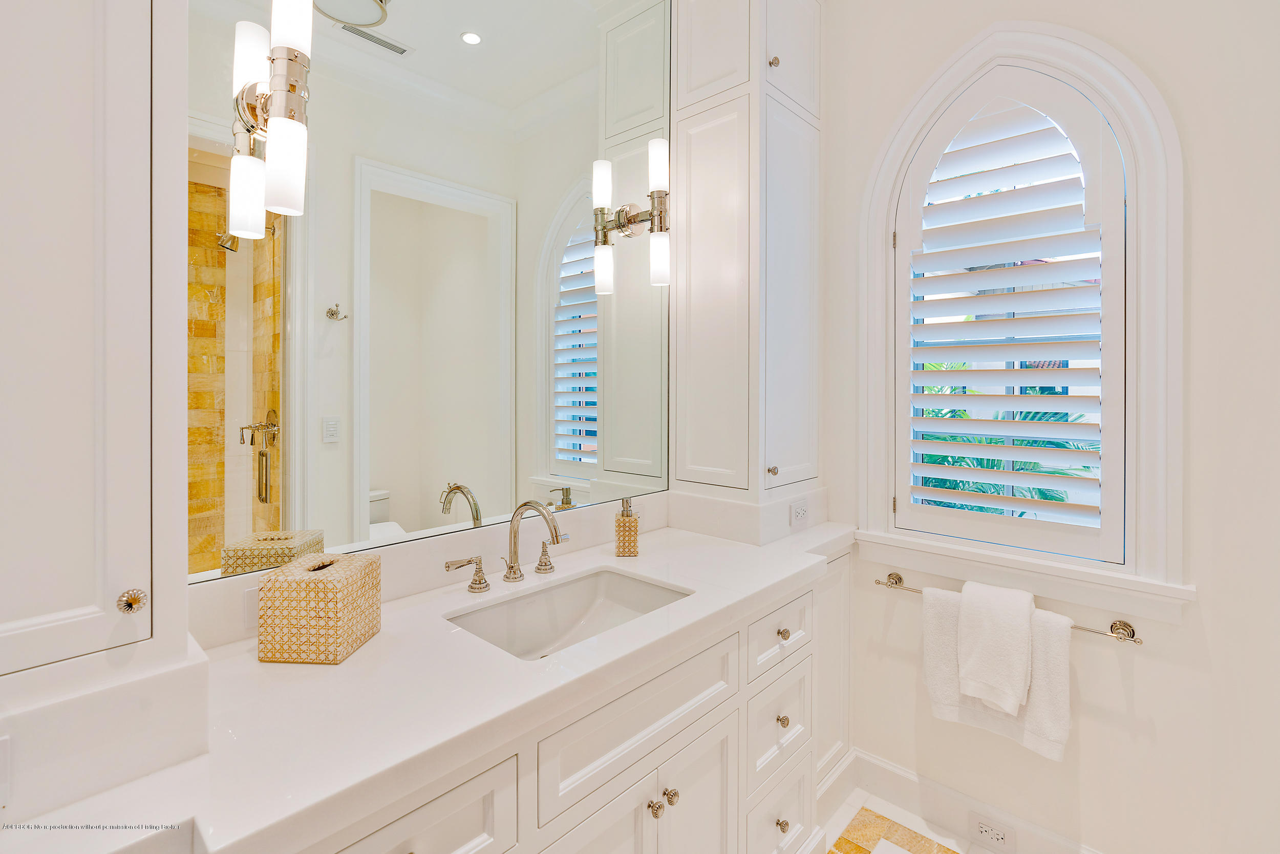 3 Via Flagler Palm Beach, FL 33480 - Photo 25 of 42 a bathroom with a sink and a mirror