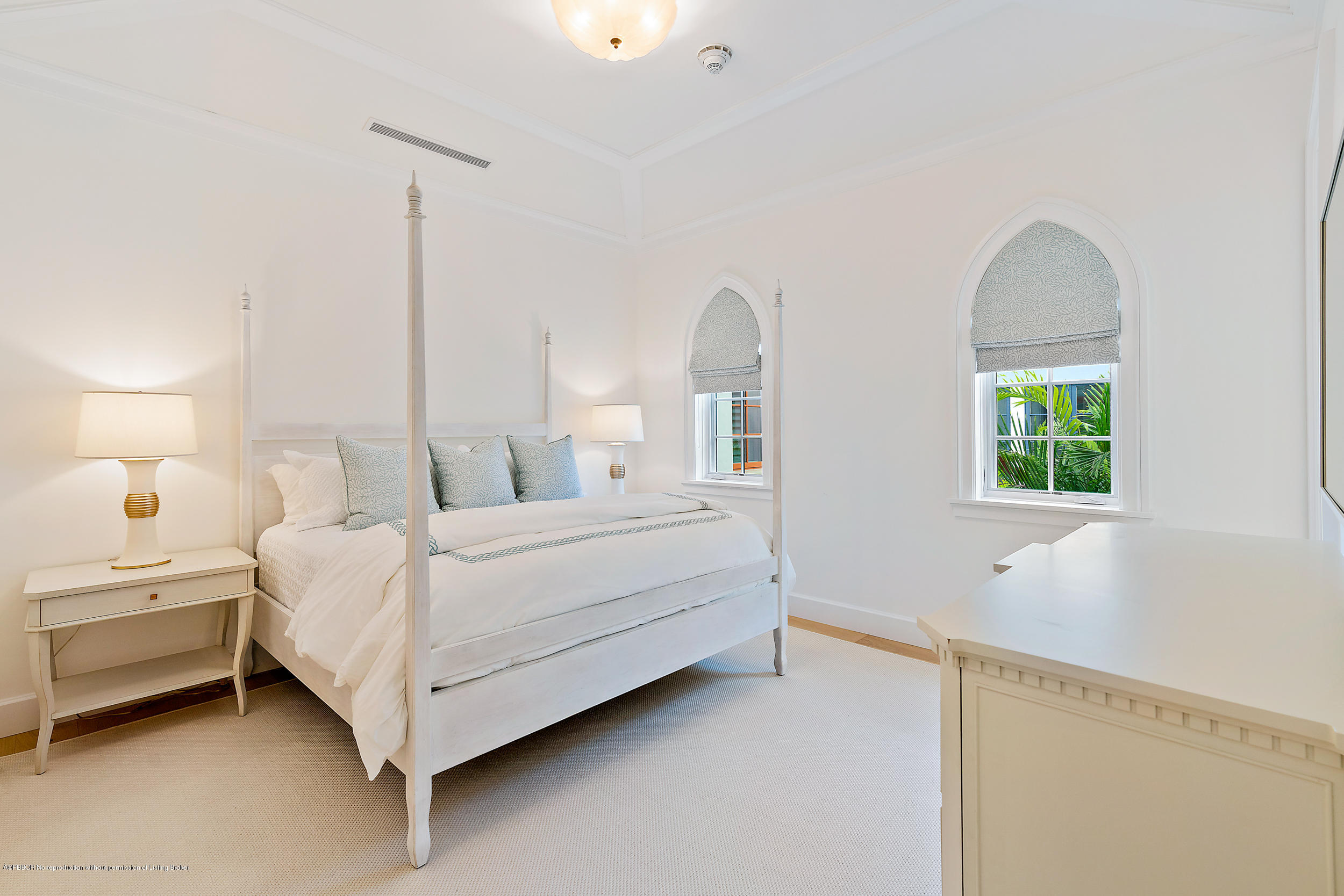 3 Via Flagler Palm Beach, FL 33480 - Photo 29 of 42 a bedroom with a bed a window and potted plant