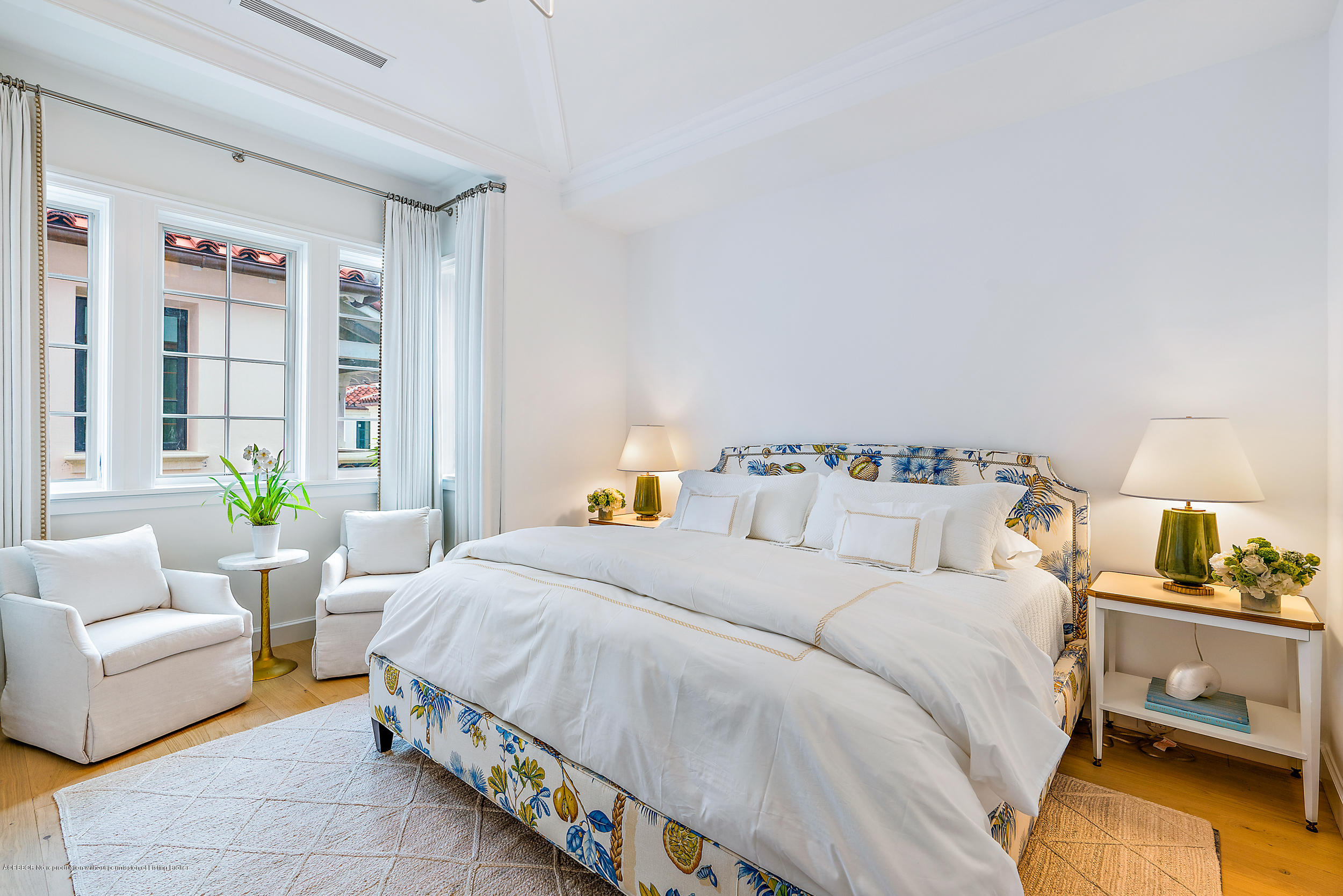 3 Via Flagler Palm Beach, FL 33480 - Photo 34 of 42 a bedroom with a bed a couch and a window