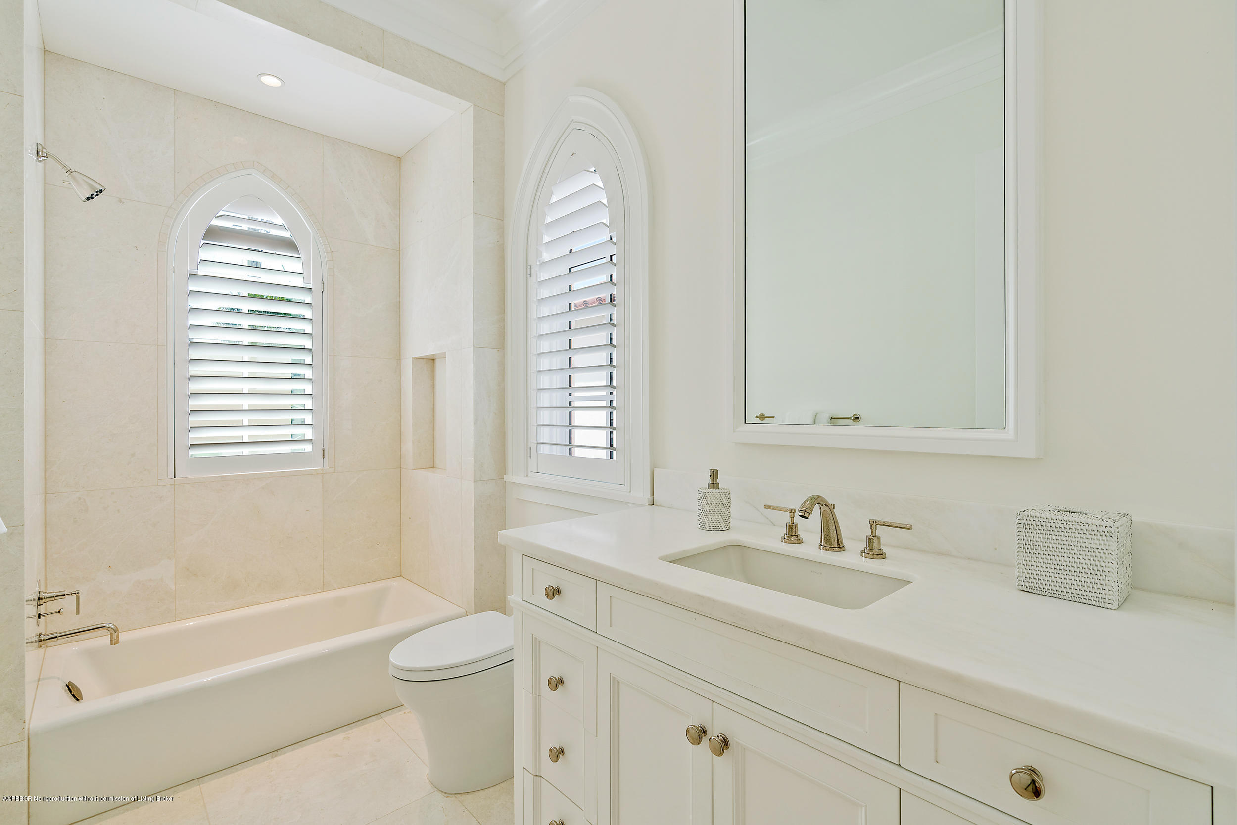 3 Via Flagler Palm Beach, FL 33480 - Photo 35 of 42 a bathroom with a sink a toilet and a bathtub