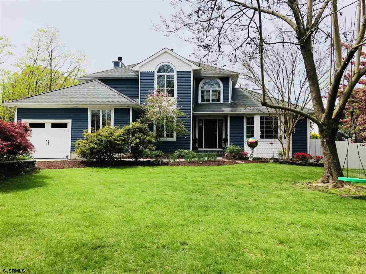 802 West Mill Road Northfield, NJ 08225 - Photo 1 of 1 a front view of a house with a garden