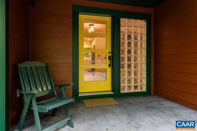 a view of an outdoor room with porch and wooden floor