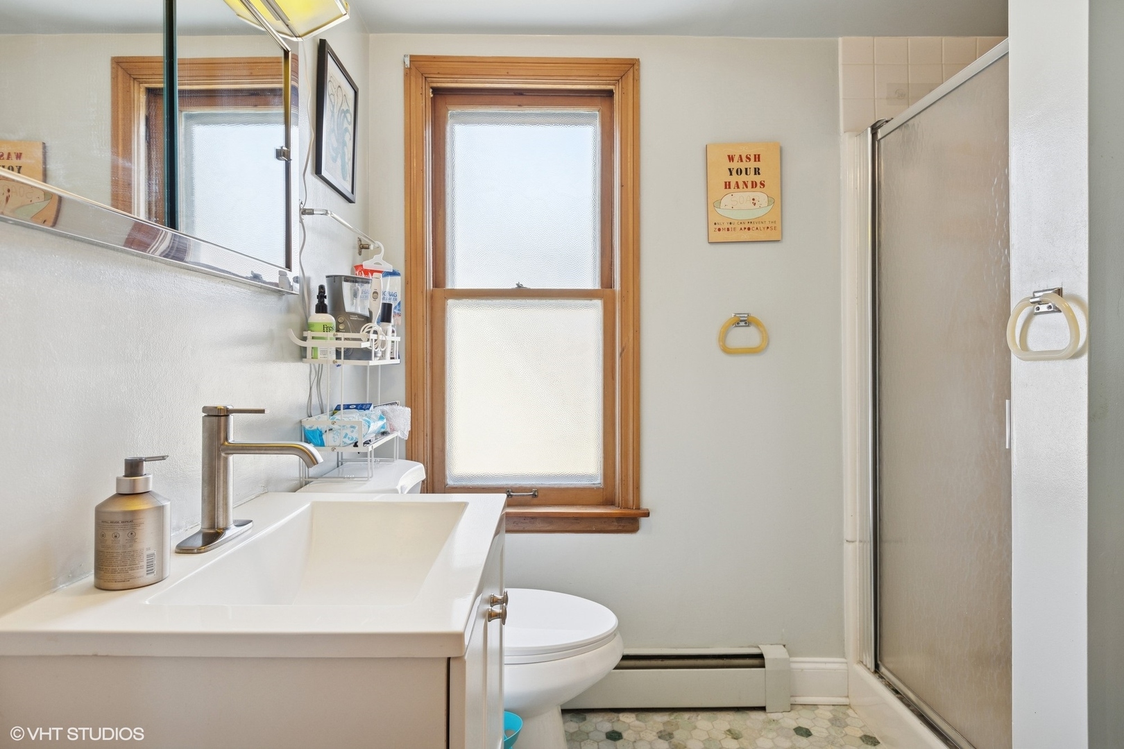 6321 North Merrimac Avenue Chicago, IL 60646 - Photo 13 of 21 a bathroom with a sink toilet and mirror