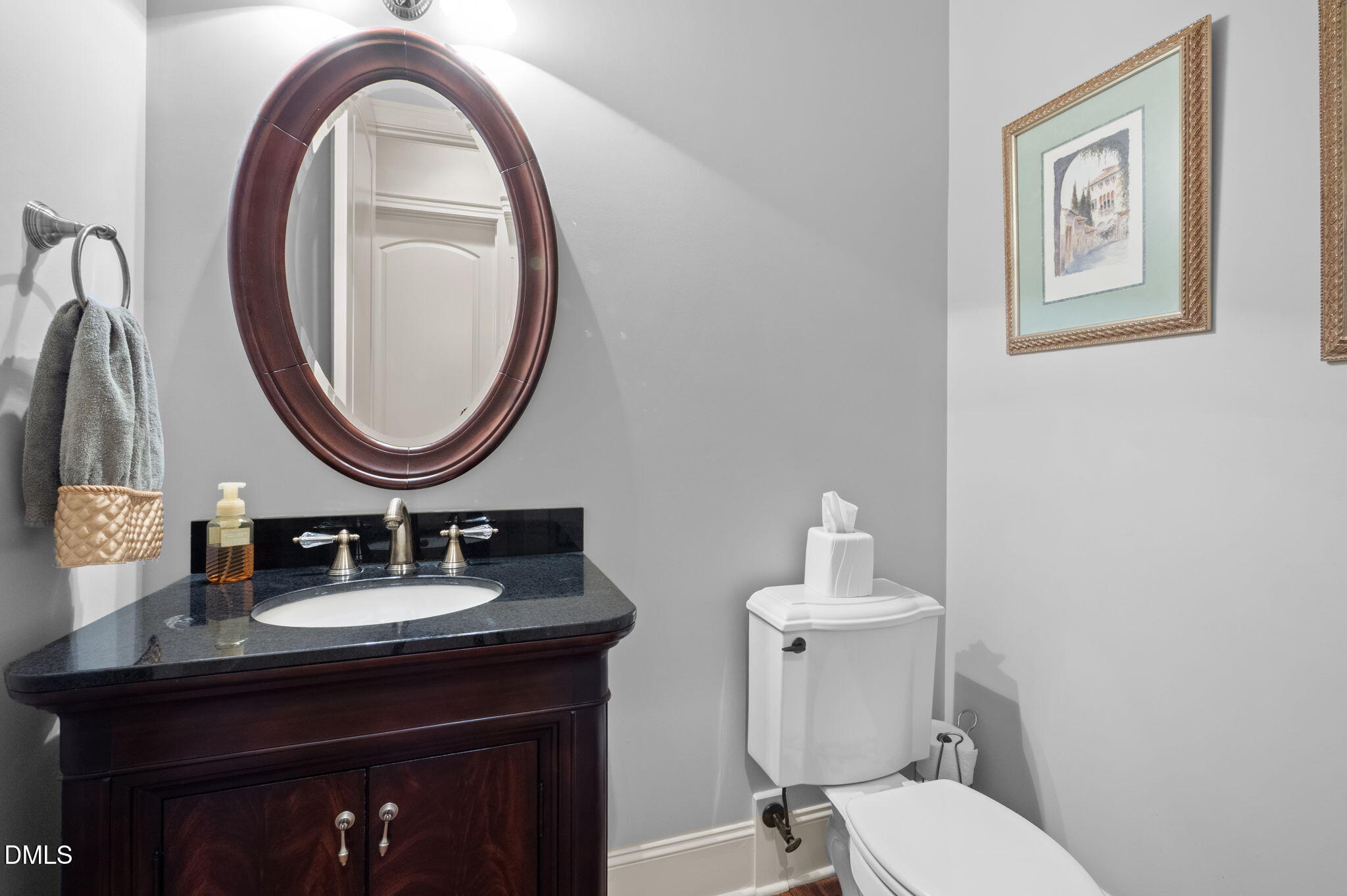 4171 English Garden Way Raleigh, NC 27612 - Photo 17 of 39 a bathroom with a sink a mirror and a toilet