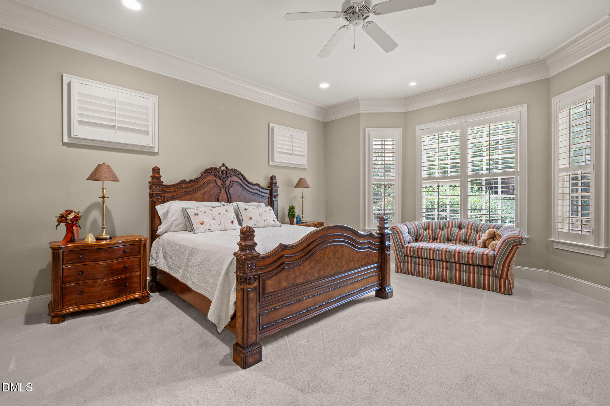 4171 English Garden Way Raleigh, NC 27612 - Photo 18 of 39 a spacious bedroom with a bed and a couch