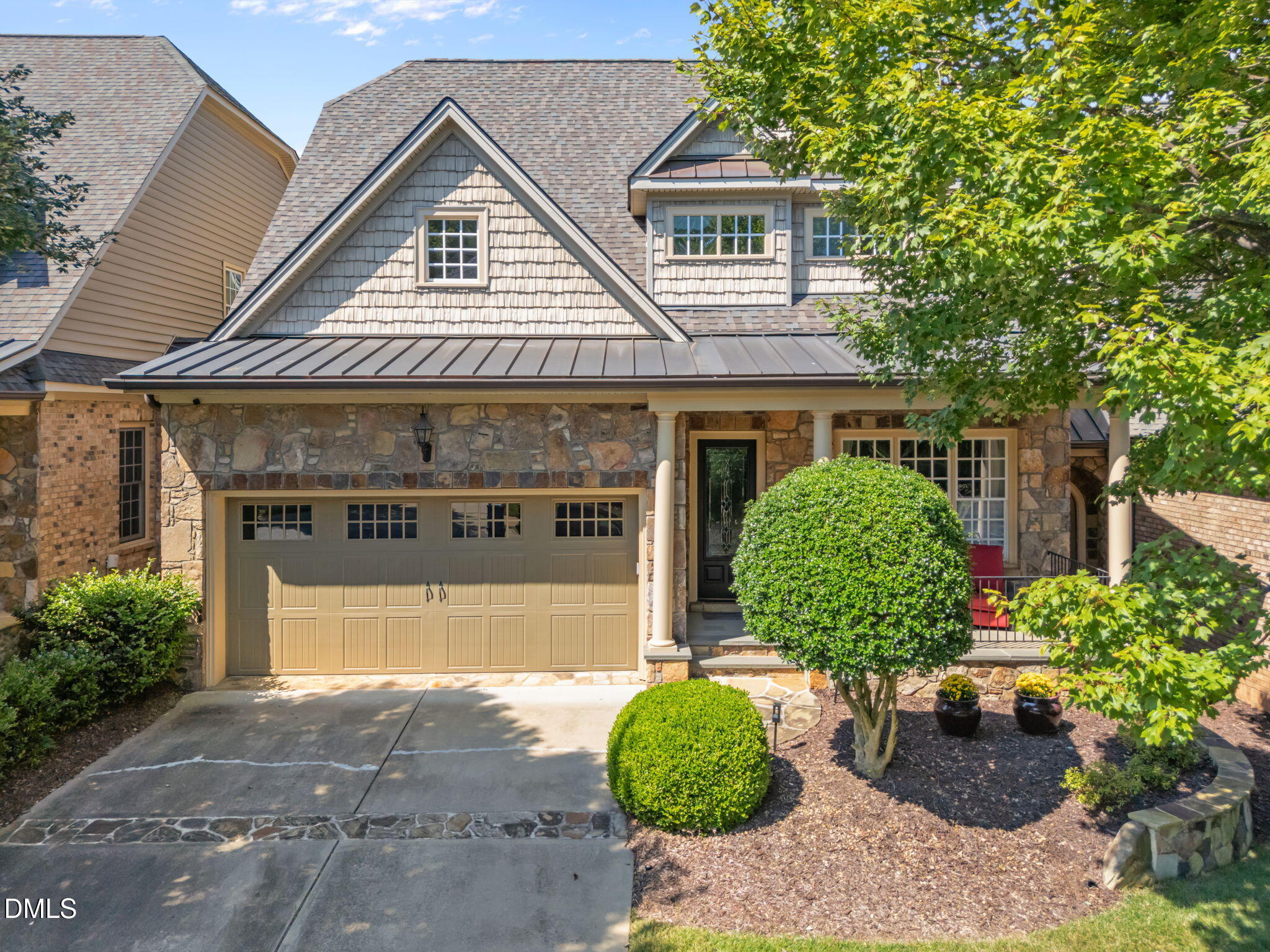 4171 English Garden Way Raleigh, NC 27612 - Photo 2 of 39 a front view of a house with garden
