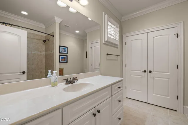 a bathroom with a sink vanity granite and a mirror
