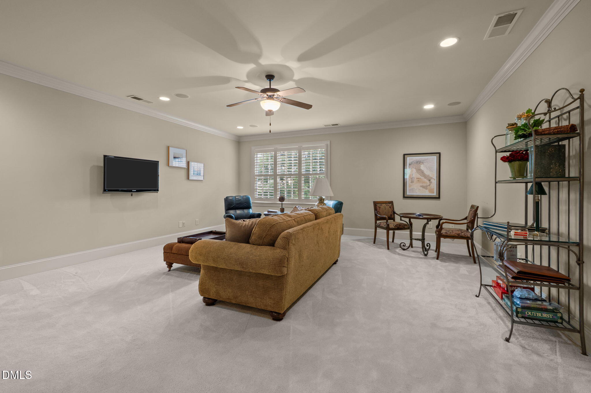4171 English Garden Way Raleigh, NC 27612 - Photo 27 of 39 a living room with furniture and a flat screen tv