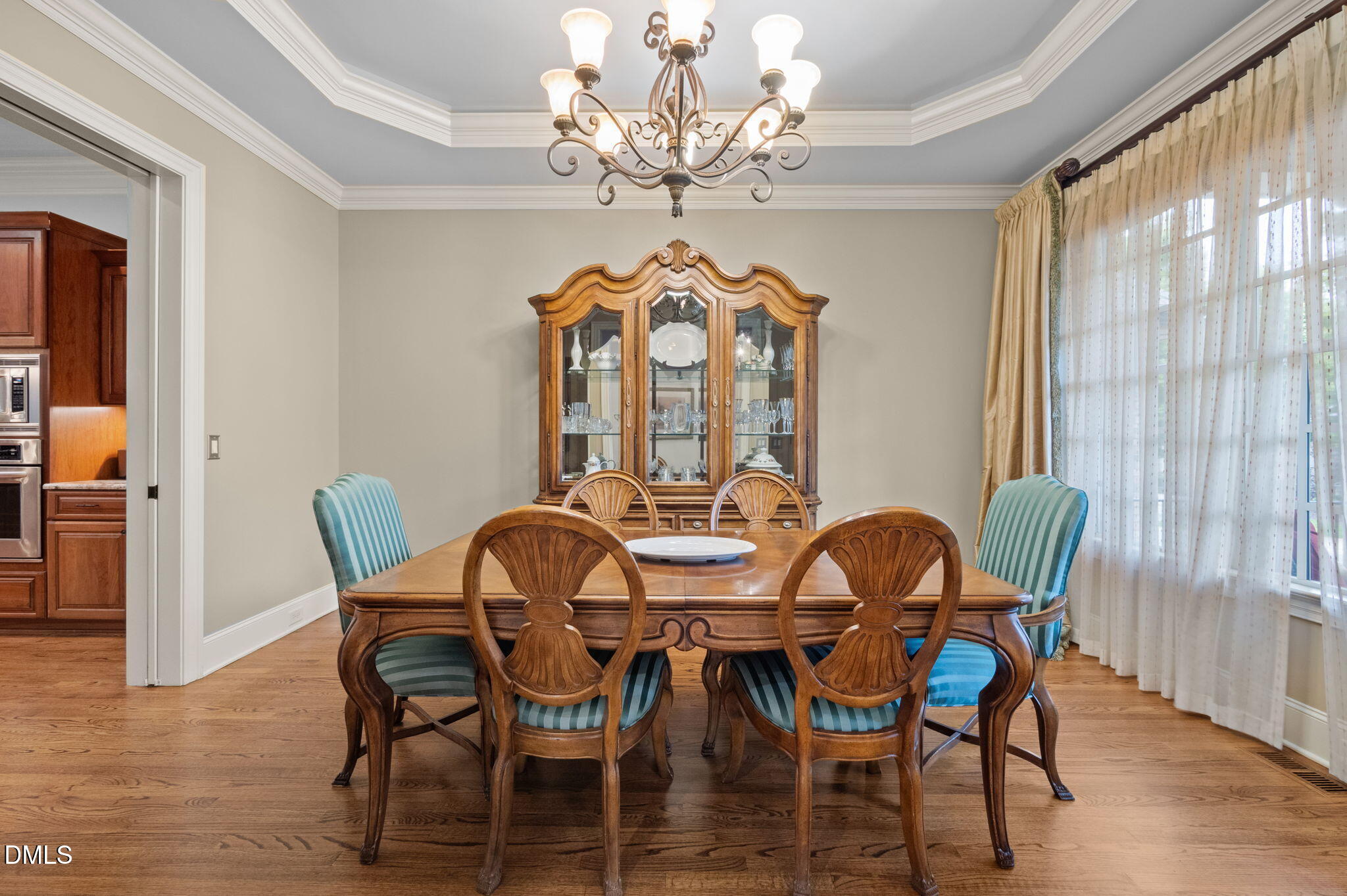 4171 English Garden Way Raleigh, NC 27612 - Photo 6 of 39 a view of a dining room with furniture window and wooden floor