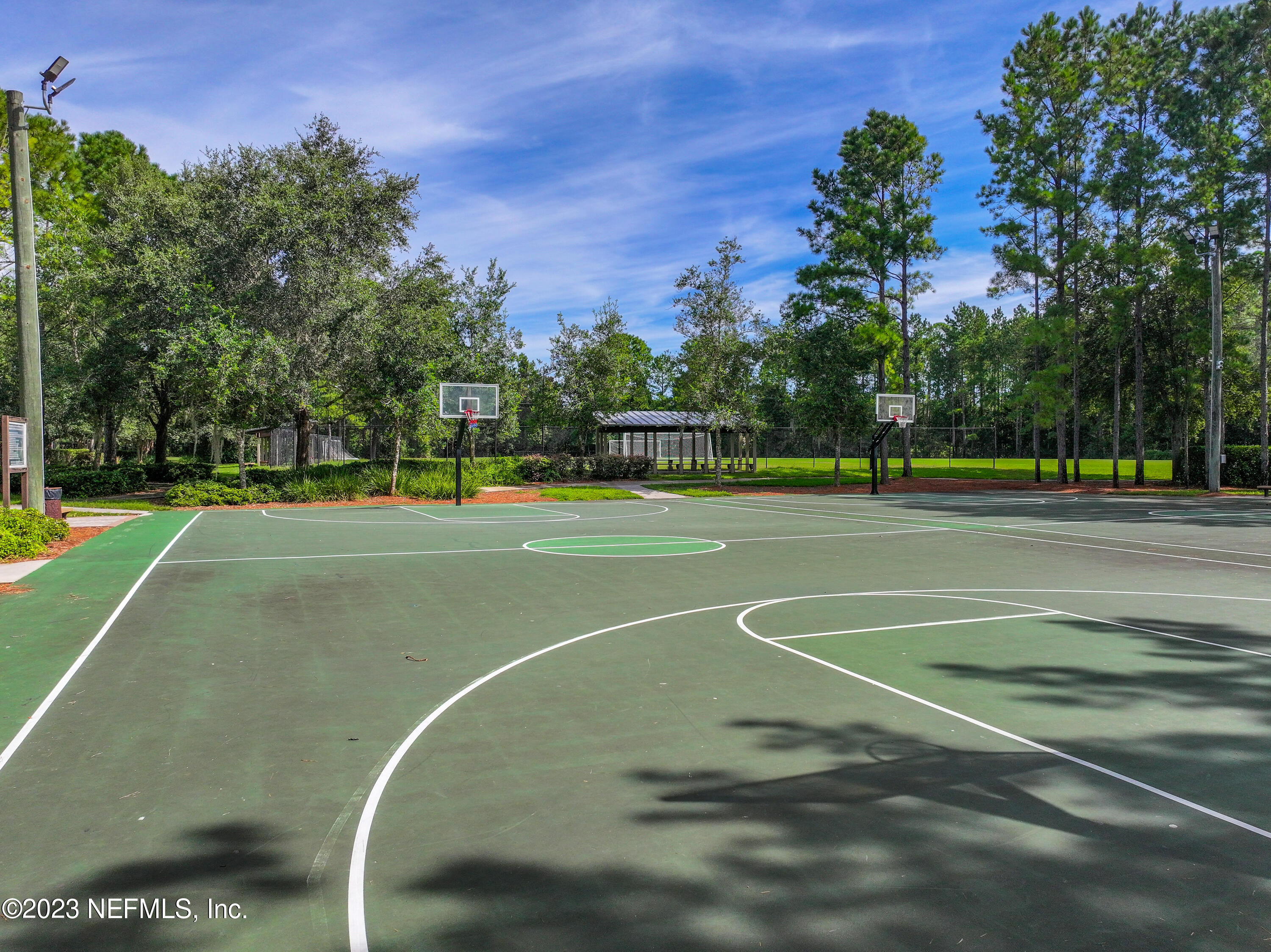 2009 River's Own Road St. Augustine, FL 32092 - Photo 54 of 59 a view of a tennis ground with large trees