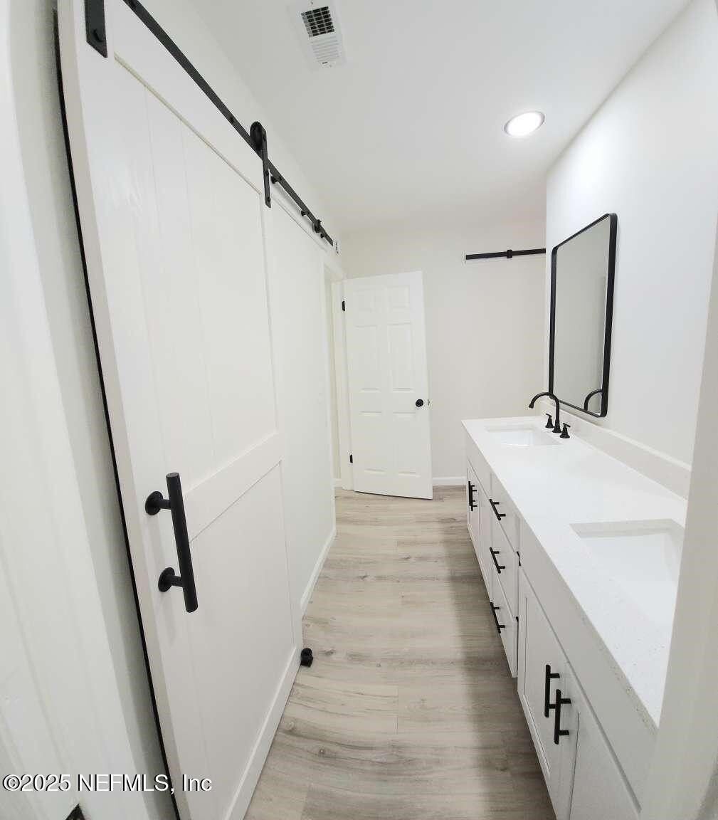 1347 Autumn Trace Fernandina Beach, FL 32034 - Photo 11 of 20 a bathroom with sink and mirror