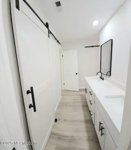 a bathroom with sink and mirror