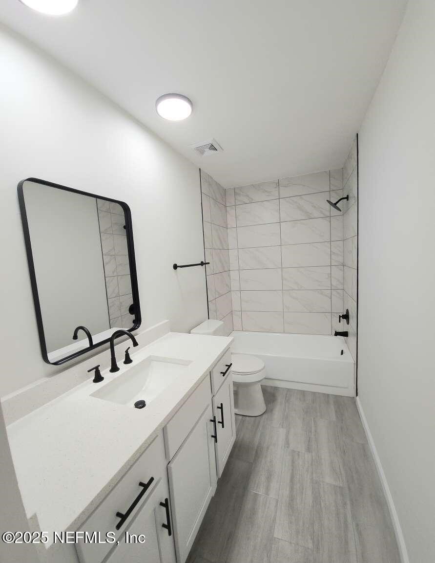 1347 Autumn Trace Fernandina Beach, FL 32034 - Photo 12 of 20 a bathroom with a sink a toilet and shower