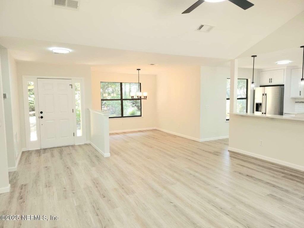 1347 Autumn Trace Fernandina Beach, FL 32034 - Photo 15 of 20 a view of empty room with wooden floor and windows