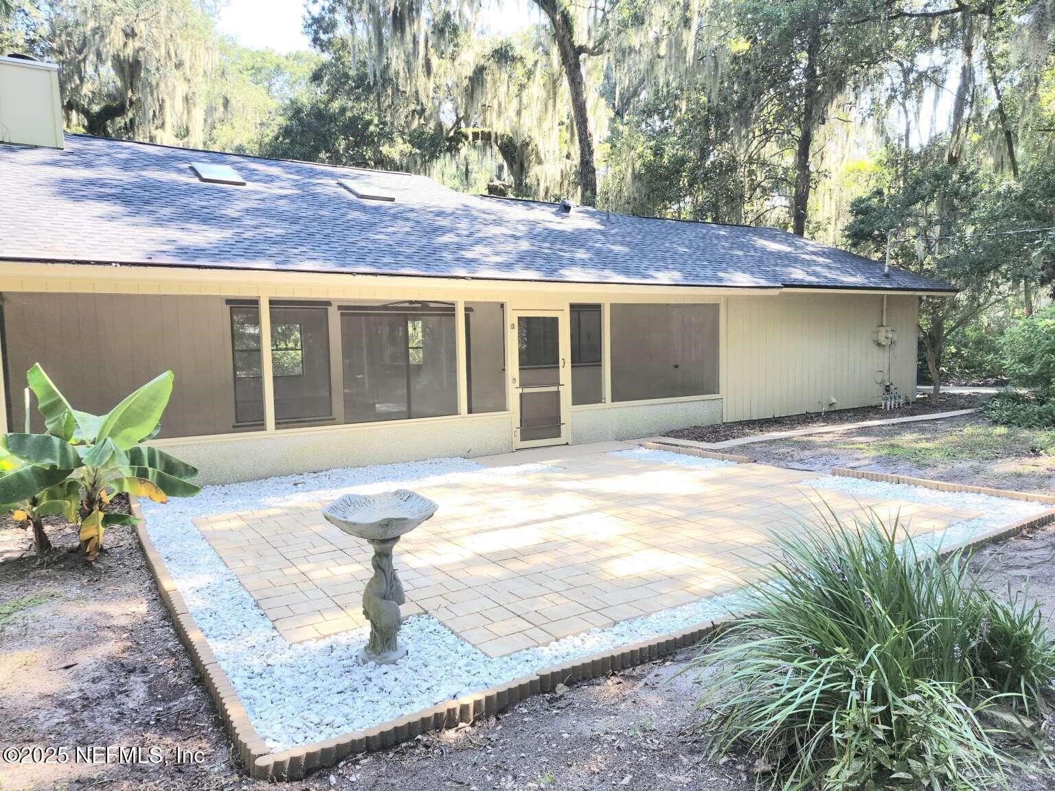 1347 Autumn Trace Fernandina Beach, FL 32034 - Photo 19 of 20 a front view of a house with garden