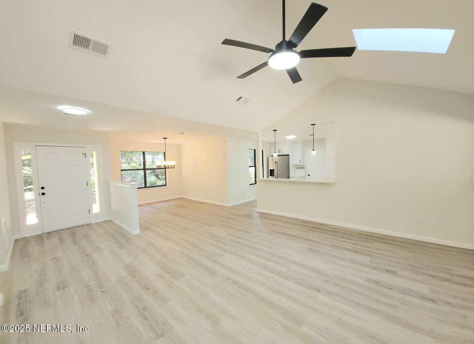 1347 Autumn Trace Fernandina Beach, FL 32034 - Photo 7 of 20 wooden floor in an empty room with a window