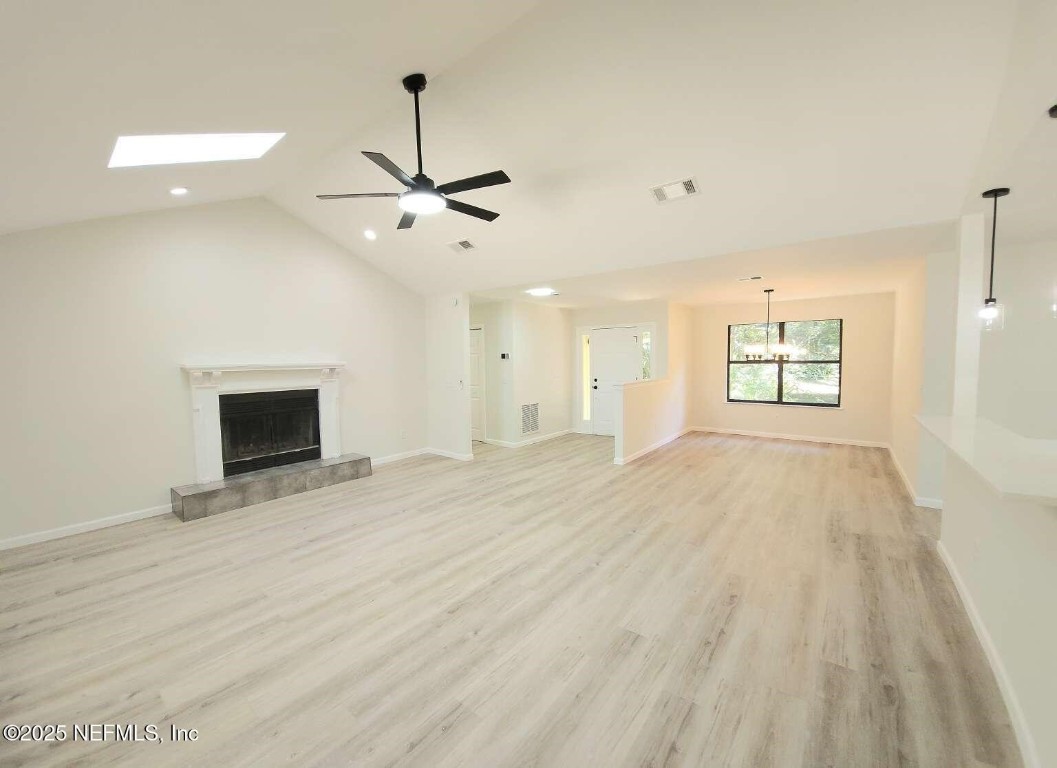 1347 Autumn Trace Fernandina Beach, FL 32034 - Photo 8 of 20 a view of an empty room with a window and a kitchen