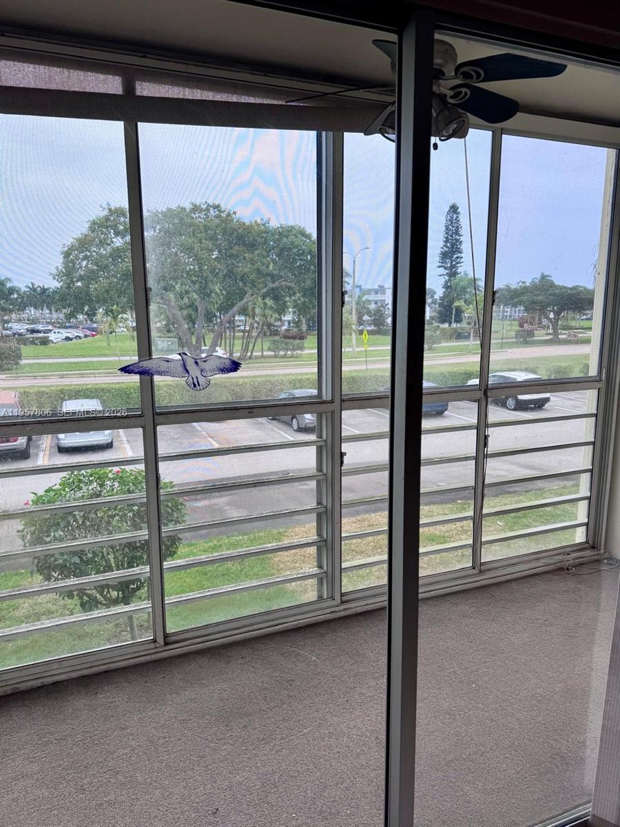 272 Dorset East, Unit G Boca Raton, FL 33434 - Photo 6 of 10 a view of a deck and yard from a balcony