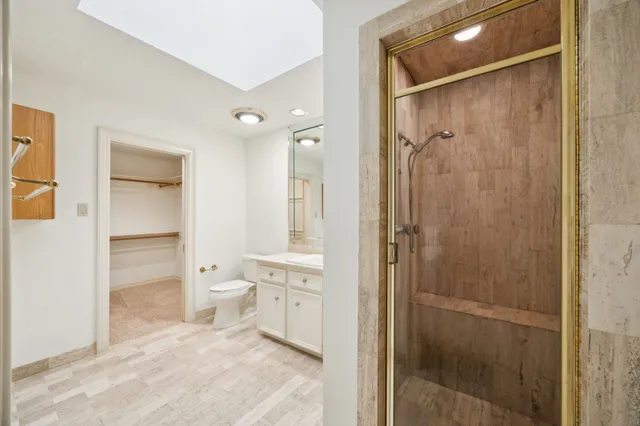 a bathroom with a shower and a sink