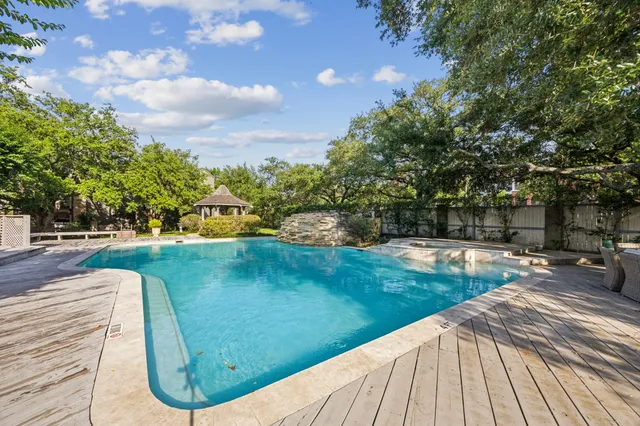 a view of a swimming pool with a patio