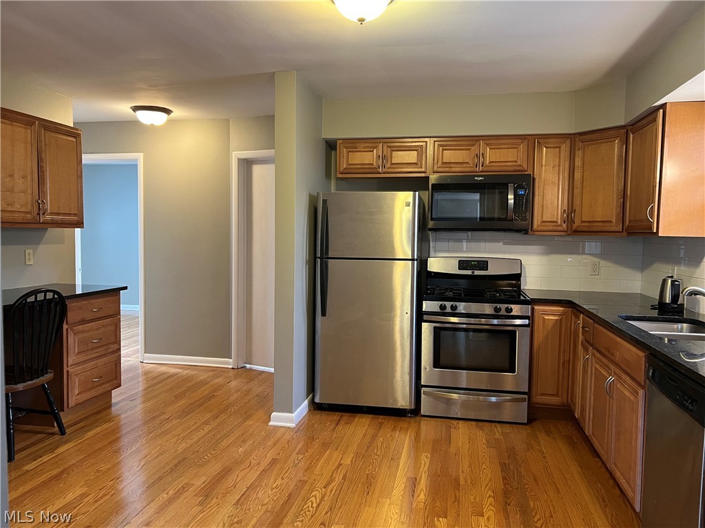 6916 York Road Parma Heights, OH 44130 - Photo 5 of 17 Spacious Kitchen, Hardwood Floors, Useful Side Board with Cabinets, Server or Handy Desk Area