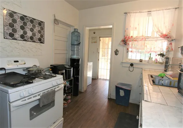 a kitchen with a stove and a refrigerator