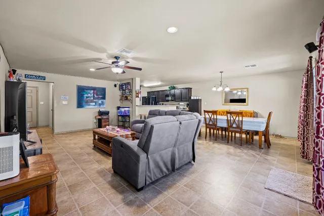 a living room with fireplace furniture and a flat screen tv