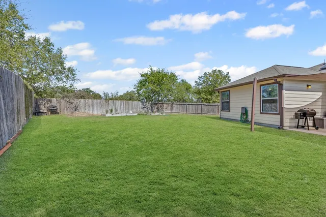 a view of a backyard with a garden