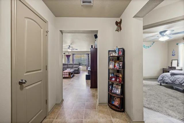 a view of a bedroom walk in closet and bedroom