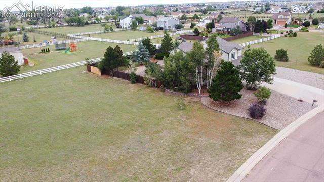 8252 Tompkins Road Peyton, CO 80831 - Photo 3 of 50 View of the south end of the acre. Tons of room for additional building.