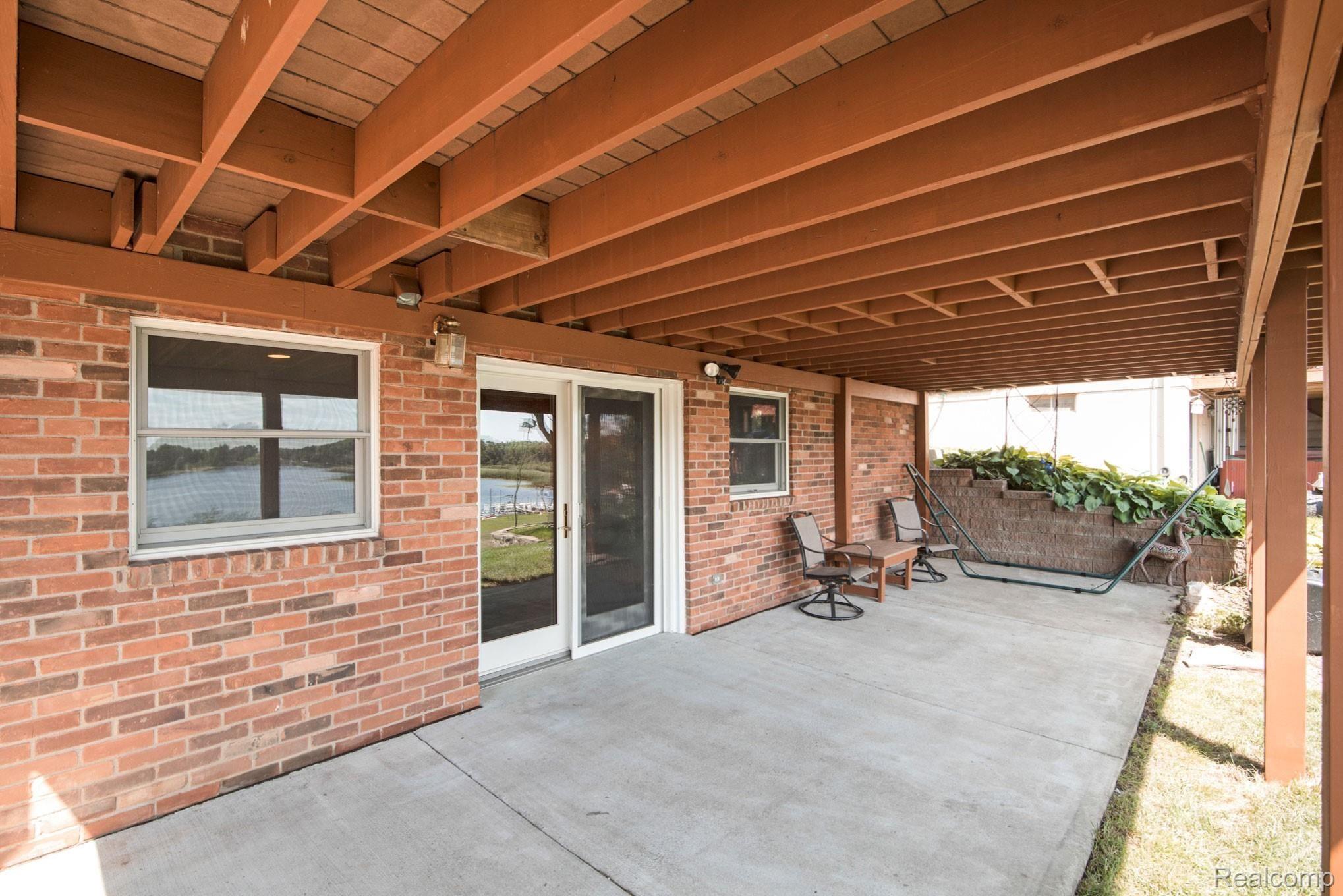 1231 Crooked Lake Road Fenton, MI 48430 - Photo 32 of 48 Walkout lower level leads out onto concrete patio.jpg