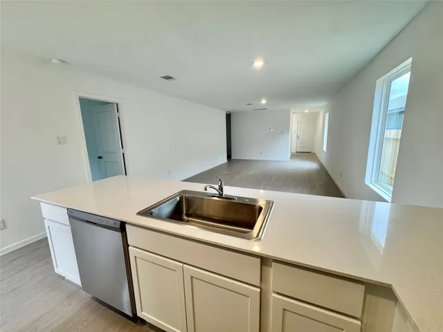 a kitchen with a sink and a refrigerator