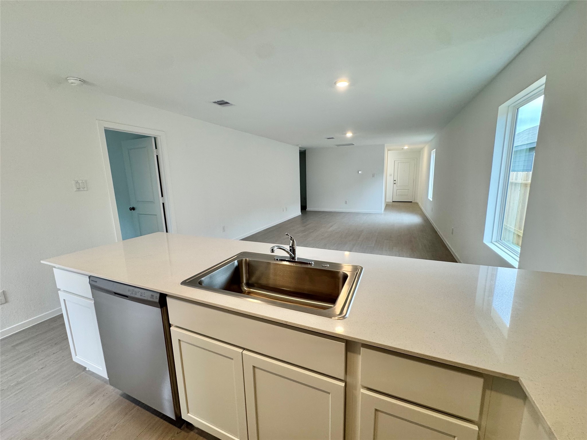 14885 North Ascot Bnd Circle Conroe, TX 77306 - Photo 4 of 14 a kitchen with a sink and a refrigerator