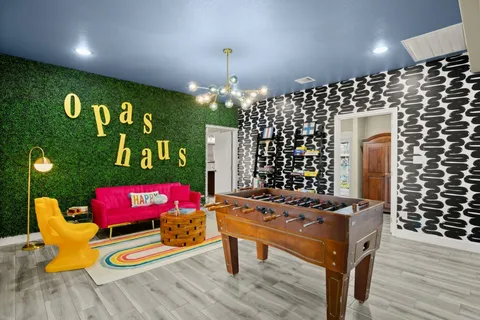 a room with furniture and chandelier