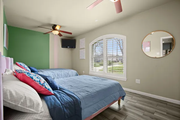 a bedroom with a bed and a window