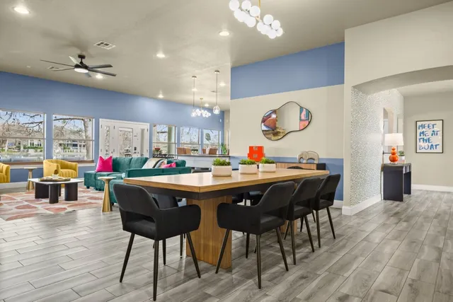 a view of a dining room with furniture and wooden floor