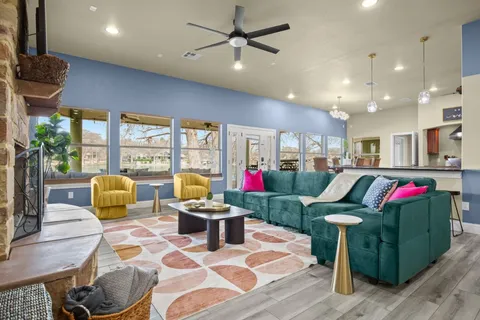 a living room filled with furniture and a potted plant
