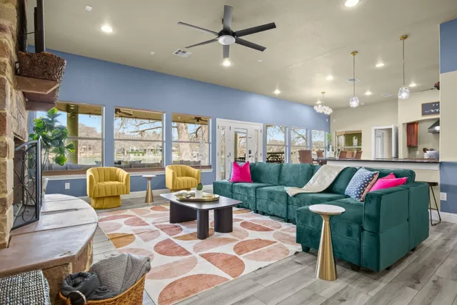 a living room filled with furniture and a potted plant