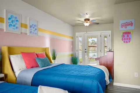 a bedroom with a bed and window