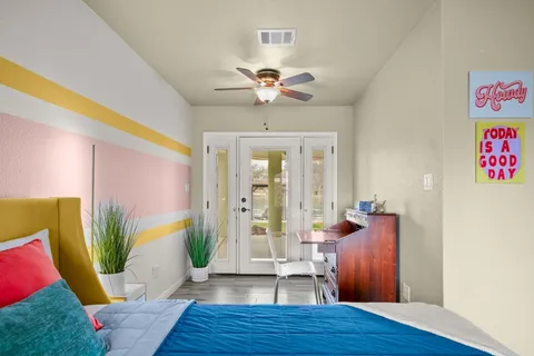 a view of a room with window and wooden floor