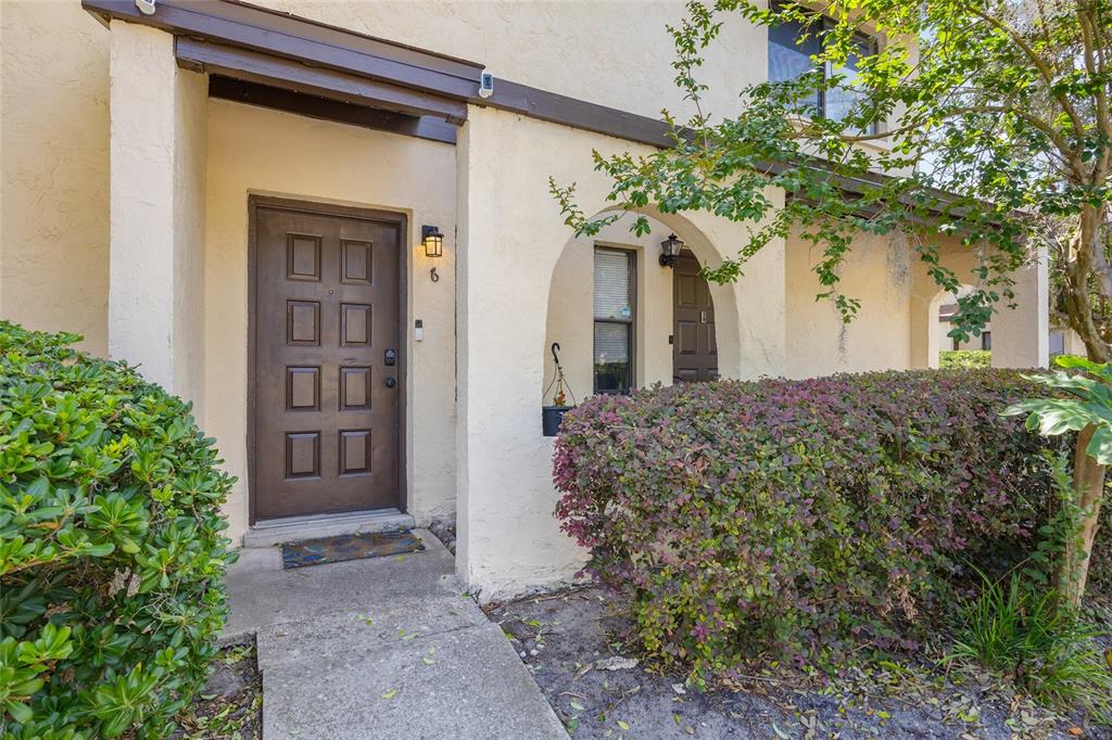 2735 Southwest 35th Place, Unit 306 Gainesville, FL 32608 - Photo 1 of 23 front view of a house with a yard