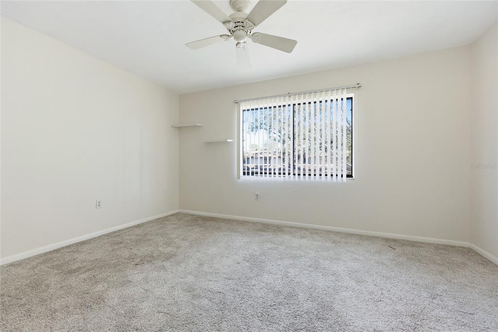2735 Southwest 35th Place, Unit 306 Gainesville, FL 32608 - Photo 12 of 17 an empty room with a empty space and windows