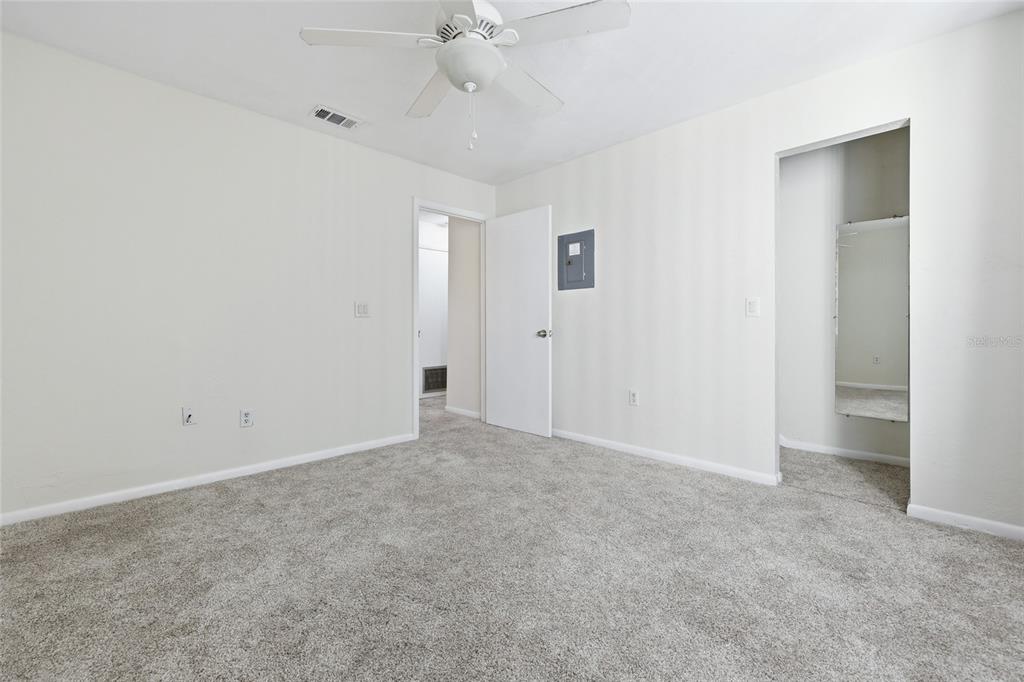 2735 Southwest 35th Place, Unit 306 Gainesville, FL 32608 - Photo 15 of 17 an empty room with a ceiling fan and a window
