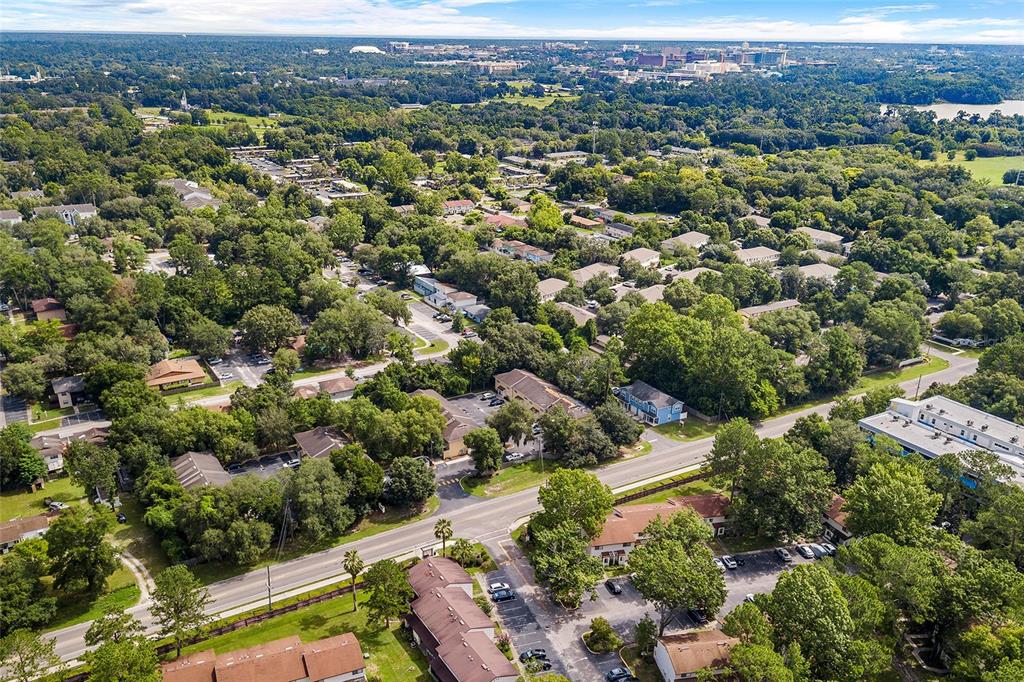 2735 Southwest 35th Place, Unit 306 Gainesville, FL 32608 - Photo 2 of 23 an aerial view of a city with lots of residential buildings