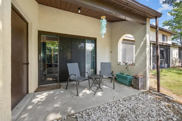 a view of a house with outdoor seating space