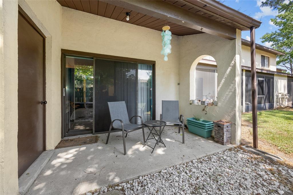 2735 Southwest 35th Place, Unit 306 Gainesville, FL 32608 - Photo 22 of 23 a view of a house with outdoor seating space