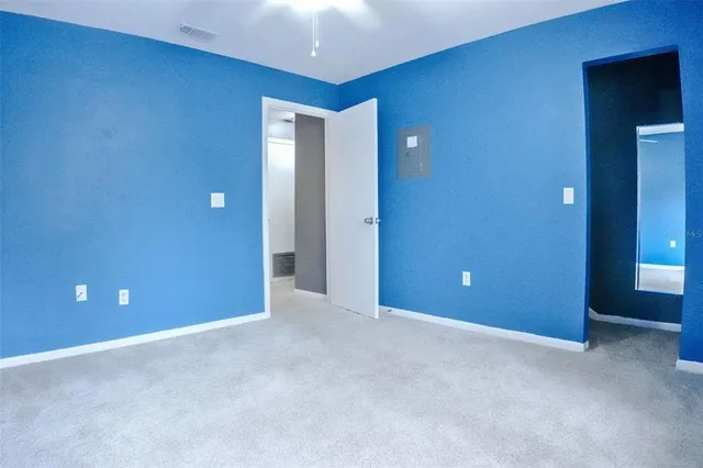 an empty room with closet area