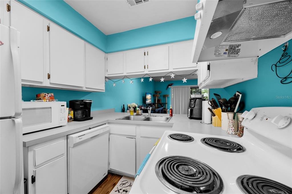 2735 Southwest 35th Place, Unit 306 Gainesville, FL 32608 - Photo 10 of 23 a kitchen with a sink and cabinets