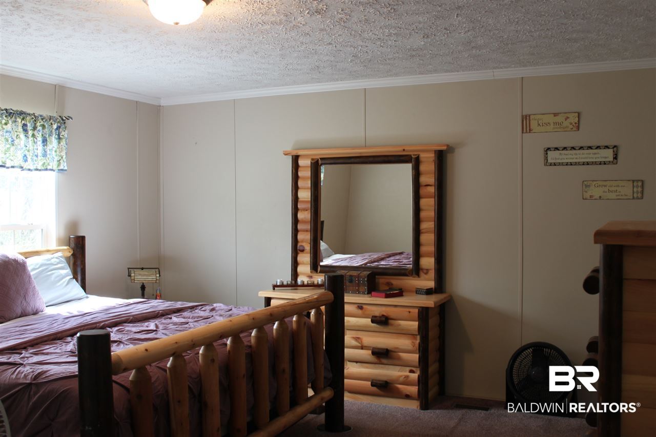 9380 Spice Pond Road Eight Mile, AL 36613 - Photo 28 of 36 Master bedroom has large walk-in closet & en-suite